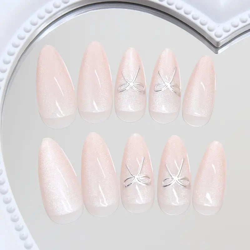 Almond Shape Nude Pink Pearlescent Shine Press-ons with a bow