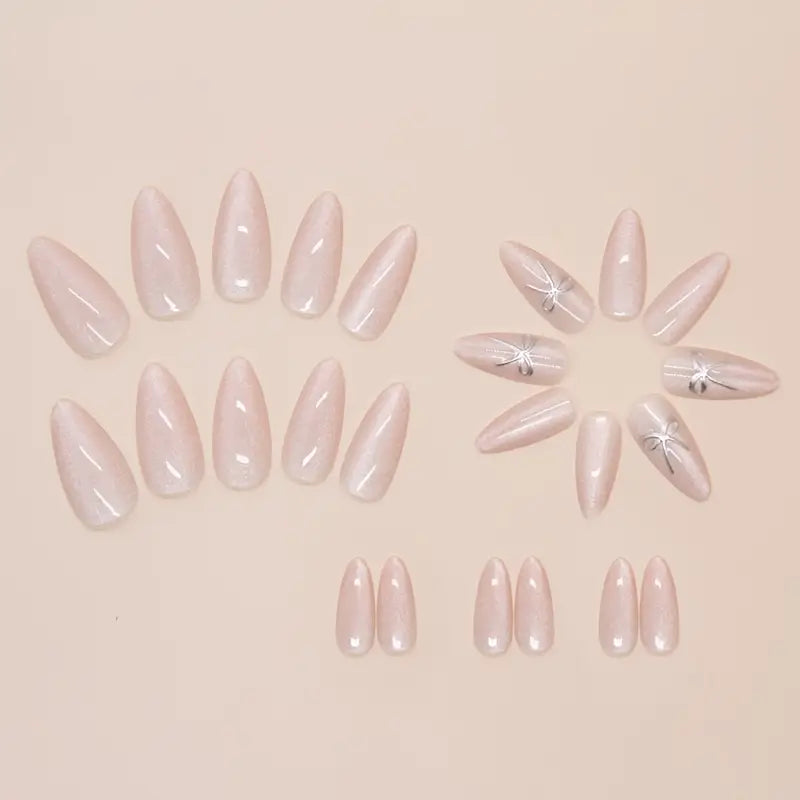 Almond Shape Nude Pink Pearlescent Shine Press-ons with a bow